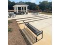 A common area with a gazebo, picnic tables and a bench at 309 Elgin Dr # 155, Lawrenceville, GA 30045