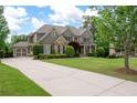 Beautiful home with a lush lawn, long driveway, and attached garage, perfect for Gathering living at 3309 Nw Past Nw Pl, Kennesaw, GA 30152