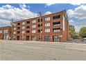 Exterior of brick building featuring balconies and large windows, street view at 346 Peters Sw St # 207, Atlanta, GA 30313