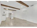 Open concept living space with exposed beams and stainless steel kitchen appliances at 346 Peters Sw St # 207, Atlanta, GA 30313