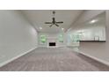 Open-concept living room features a fireplace and lots of natural light at 3681 Auger Trl, Douglasville, GA 30135