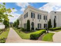 Beautiful two-story home with a well-manicured lawn and classic white brick facade at 316 S Esplanade, Alpharetta, GA 30009