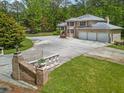 An aerial view of a brick home's driveway and gated entry provide privacy and security at 5302 Greenway Dr, Villa Rica, GA 30180