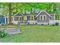 Attractive single-Gathering home with lush green lawn and inviting yellow entryway at 183 Oak Dr, Atlanta, GA 30354