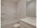 Clean bathroom featuring a bathtub, shower, vanity, and white toilet at 1976 Deco Dr, Kennesaw, GA 30144