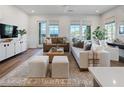 Bright living room showcases a modern design with hardwood floors and neutral-toned furniture at 920 Hughley Circle # 74, Atlanta, GA 30316