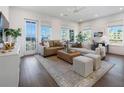 Bright living room features lots of natural light, neutral-toned furniture, and hardwood floors at 920 Hughley Circle # 74, Atlanta, GA 30316