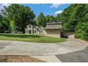 Beautiful home with lush greenery and a spacious driveway at 387 Nickajack Se Rd, Mableton, GA 30126