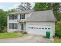 Charming two-story home featuring a classic colonial design and an attached two-car garage at 7117 Stonebrook Cv, Lithonia, GA 30058