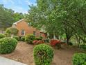 Brick home featuring a front porch and mature landscaping for added curb appeal at 4515 N. Slope Cir, Marietta, GA 30066