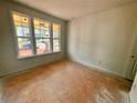 Bright bedroom with ample natural light streaming in from large windows at 7252 Eton Ln, Locust Grove, GA 30248