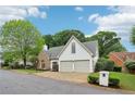Charming home with stone accents, two-car garage and manicured lawn on a cul-de-sac at 979 Bridgegate Ne Dr, Marietta, GA 30068