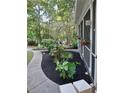 Lush landscaping, including a fountain and flower baskets, adds charm to this home's exterior at 3978 Devonshire Dr, Marietta, GA 30066