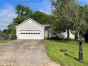 Charming single-Gathering home with two-car garage, mailbox and manicured front yard at 53 Villa Rosa Way, Temple, GA 30179