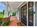 Inviting front porch with a black front door and a cozy swing, offering a warm welcome to the home at 1349 Middlesex Ne Ave, Atlanta, GA 30306