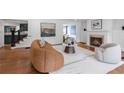 Elegant living room showcasing hardwood floors, a fireplace, and an open layout at 1349 Middlesex Ne Ave, Atlanta, GA 30306
