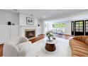 Bright living room with fireplace, hardwood floors, and updated fixtures creates an inviting atmosphere at 1349 Middlesex Ne Ave, Atlanta, GA 30306