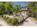 Charming home features a white picket fence and well-manicured front yard at 2406 Glenwood Ne Dr, Atlanta, GA 30305