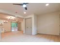 Open-concept living area with sleek light-colored floors and modern lighting fixtures at 4396 Greenleaf Cir, Atlanta, GA 30331