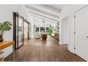 Open-concept living area featuring hardwood floors, high ceilings, and ample natural light at 5785 Timberlane Ter, Sandy Springs, GA 30328
