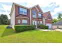 Charming two-story home with well-maintained lawn and brick and vinyl siding at 1506 Saint George Pl, Conyers, GA 30012