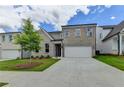 Attractive two-story house featuring a brick facade, two-car garage, and a well-maintained lawn at 3968 Annsbury Court, Lilburn, GA 30047