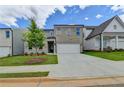Beautiful home showcasing a brick exterior, attached garage, complemented by green lawn and landscaping at 3968 Annsbury Court, Lilburn, GA 30047