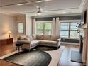 Bright living room featuring hardwood floors, a fireplace, and large windows at 702 Emeril Dr, Avondale Estates, GA 30002