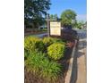 Community sign for Sherwood Oaks nestled in lush greenery, offering a welcoming first impression at 4299 Sherwood Oaks Dr, Decatur, GA 30034