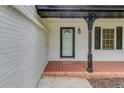 Welcoming front porch with tiled flooring and decorative support columns at 1728 Hudson Rd, Decatur, GA 30033