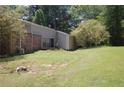 Large backyard features an expansive lawn and mature trees, with easy access from home at 3215 Hembry Ct, Marietta, GA 30062