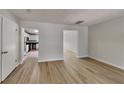 Inviting living room boasts neutral walls, and seamless access to the kitchen and other living spaces at 829 Longfellow Ct, Stone Mountain, GA 30088
