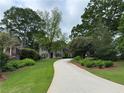 Beautiful home with a long driveway and lush green lawn at 2038 Lee Se Rd, Smyrna, GA 30080