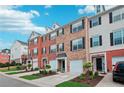 Well-kept townhomes with brick and vinyl exteriors, each featuring an attached garage and landscaped front gardens at 3846 Chattahoochee Summit Se Dr # 31, Atlanta, GA 30339