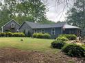 Expansive backyard featuring manicured landscaping and a detached garage at 284 Harris Loop, Dallas, GA 30157
