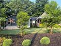 Beautifully landscaped front yard showcasing a well-maintained lawn and attractive plantings at 284 Harris Loop, Dallas, GA 30157