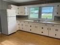 Spacious kitchen featuring ample cabinet space, neutral countertops, and a functional layout at 66 Lakeshore Dr, Bowdon, GA 30108