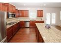 Well-appointed kitchen with granite countertops, stainless steel appliances, and a center island at 2405 Brisbane Dr, Conyers, GA 30013
