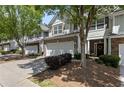 A well-maintained townhome complex featuring garages and landscaped grounds at 441 Mountain View Ln, Woodstock, GA 30188