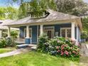 Attractive blue home with landscaped front yard and covered porch at 120 Warren Ne St, Atlanta, GA 30317