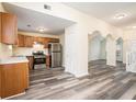 Kitchen featuring wood cabinets, stainless steel appliances, and stone countertops at 2722 South Hills, Riverdale, GA 30296