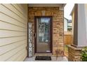 Close-up of a charming front door with stone surround, a Welcome sign and wreath at 3637 Sweet Ashley Ln, Loganville, GA 30052