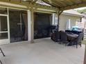 Covered patio with string lights, ceiling fans, and furniture creating an inviting outdoor space at 70 Paladin Dr, Covington, GA 30016