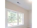 A window in a room that lets in natural light, showing the outdoor scenery at 1991 Deco Dr, Kennesaw, GA 30144