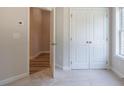 Neutral bedroom with closet and opening to another room at 1979 Deco Dr, Kennesaw, GA 30144