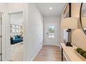 A bright entryway leads to a modern living space, highlighted by sleek floors and a contemporary design at 7145 Brushwood Bend - Lot 41, Lithonia, GA 30058