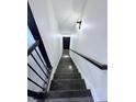 View up the staircase of the townhouse with dark wood railings at 3076 Quantum Ln, Atlanta, GA 30341