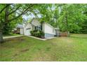 Well-manicured lawn surrounds the exterior of this beautiful single-Gathering home at 1031 Abercorn Way, Douglasville, GA 30134