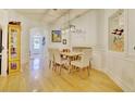 Bright dining room with wood floors, modern light fixture, and stylish decor at 2457 Birkhall Way, Lawrenceville, GA 30043