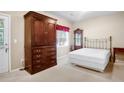 Bedroom with large wardrobe, full-sized bed, and private door to the backyard at 2108 Waters Edge Trl, Roswell, GA 30075